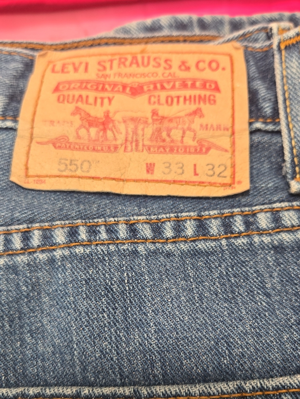 Levi's Men's Relaxed Fit Jeans in Blue Denim with Tan Leather Patch